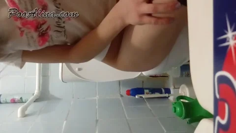 PooAlina – Young lady Alina shitting on toilet in the morning 11